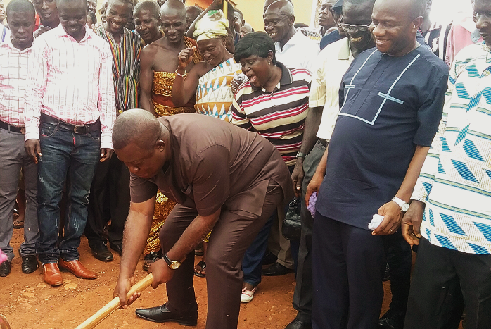 The Ashanti Regional Minister, Mr John Alexander Ackon, cutting the sod for the official commencement of the road project